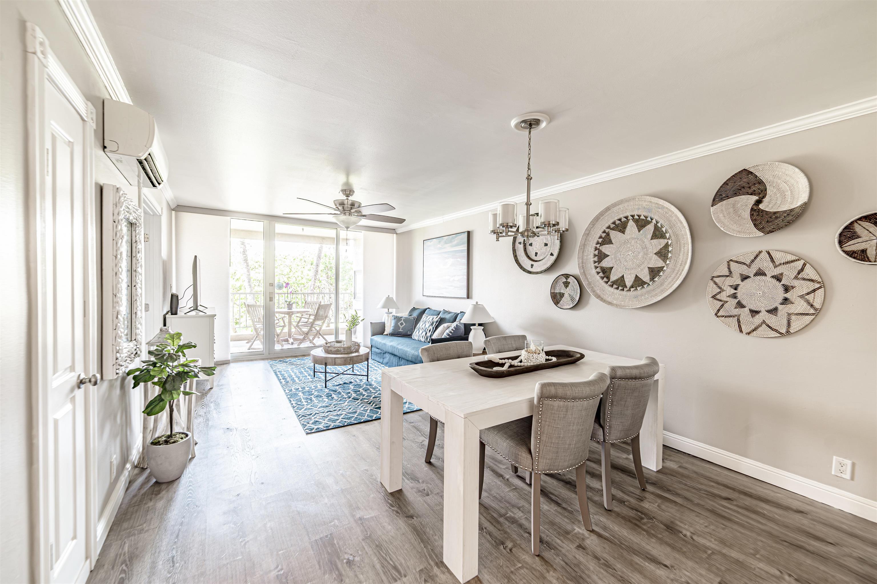 760 South Kihei Road, Unit 202 Kihei, HI 96753 - Photo 2 of 31 a view of a dining room with furniture window and wooden floor
