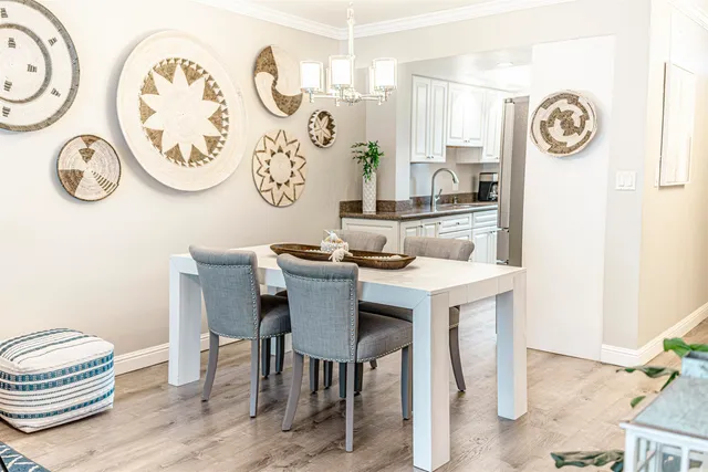 a dining room with furniture and a window
