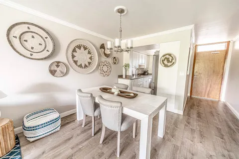 a view of a dining area with furniture and a clock