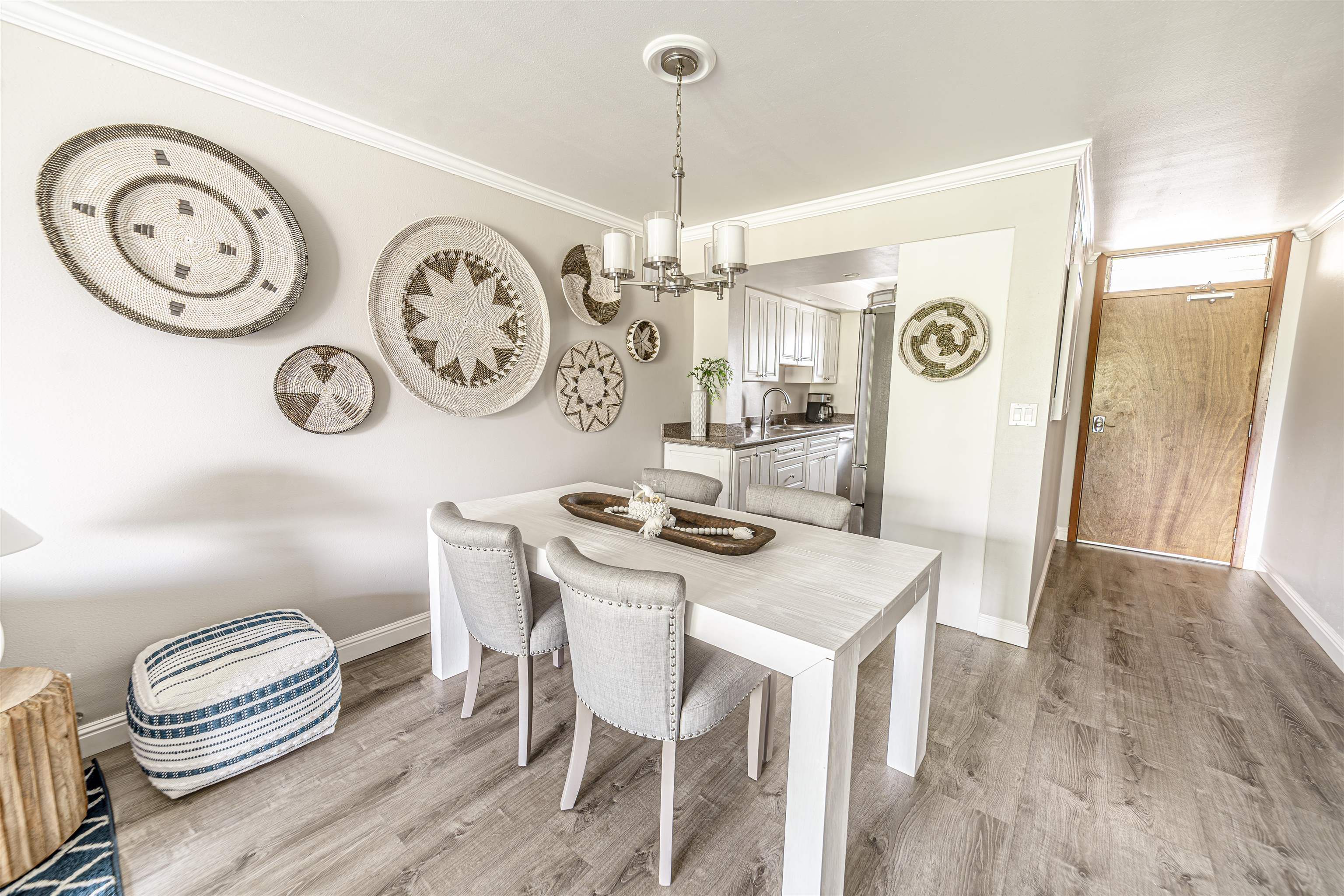 760 South Kihei Road, Unit 202 Kihei, HI 96753 - Photo 6 of 31 a view of a dining area with furniture and a clock