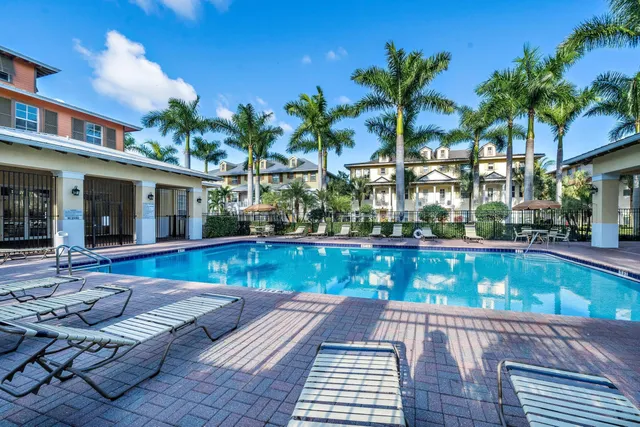 a view of a patio with swimming pool table and chairs
