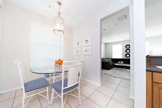 a kitchen with a table and chairs in it