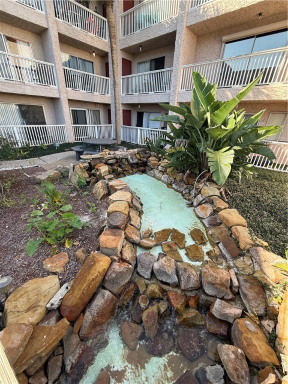 14428 Compass Street, Unit 101 Corpus Christi, TX 78418 - Photo 16 of 16 a street view with tall buildings