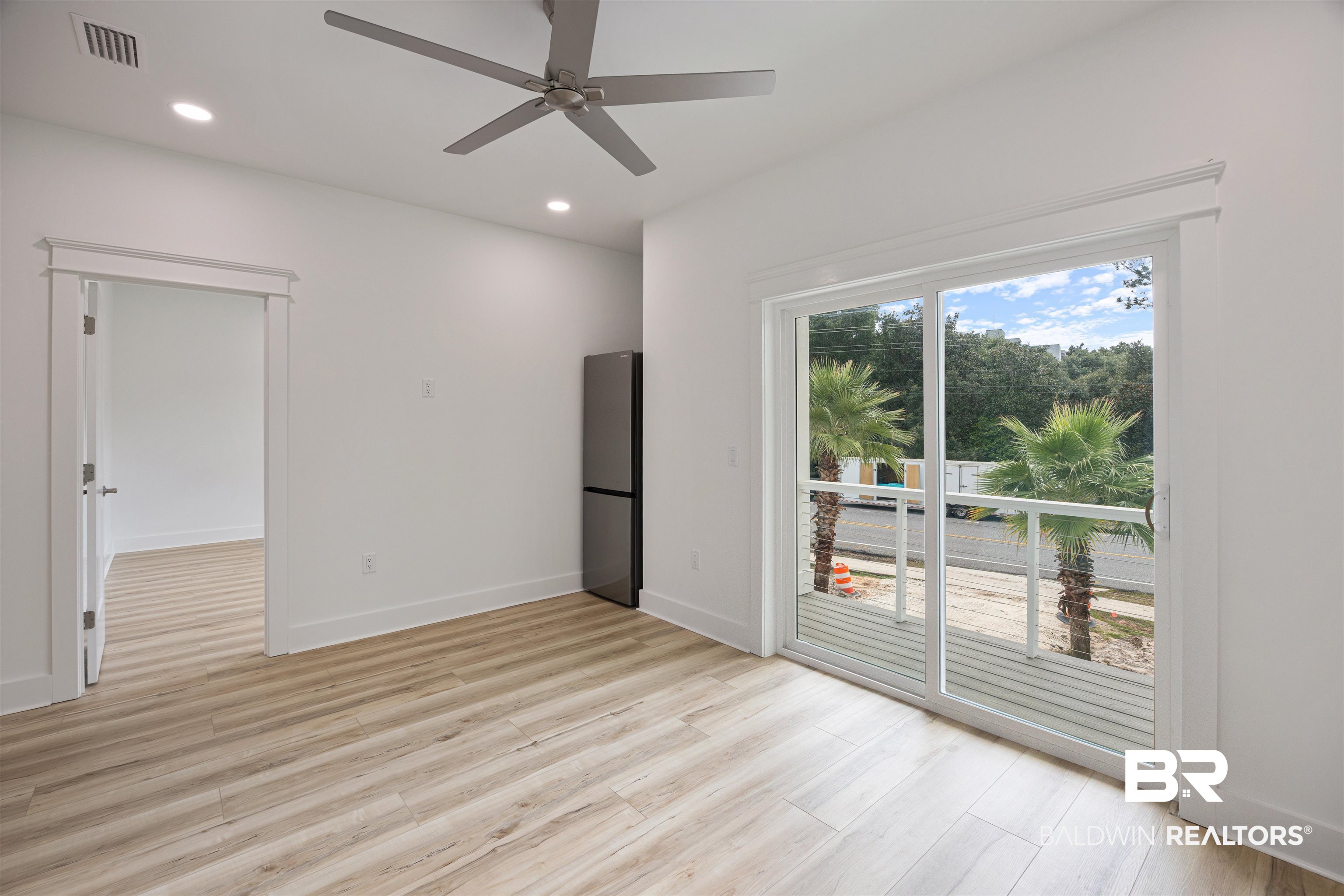 27591 Canal Road Orange Beach, AL 36561 - Photo 46 of 51 Unfurnished bedroom featuring recessed lighting, light wood-style floors, access to outside, ceiling fan, and freestanding refrigerator