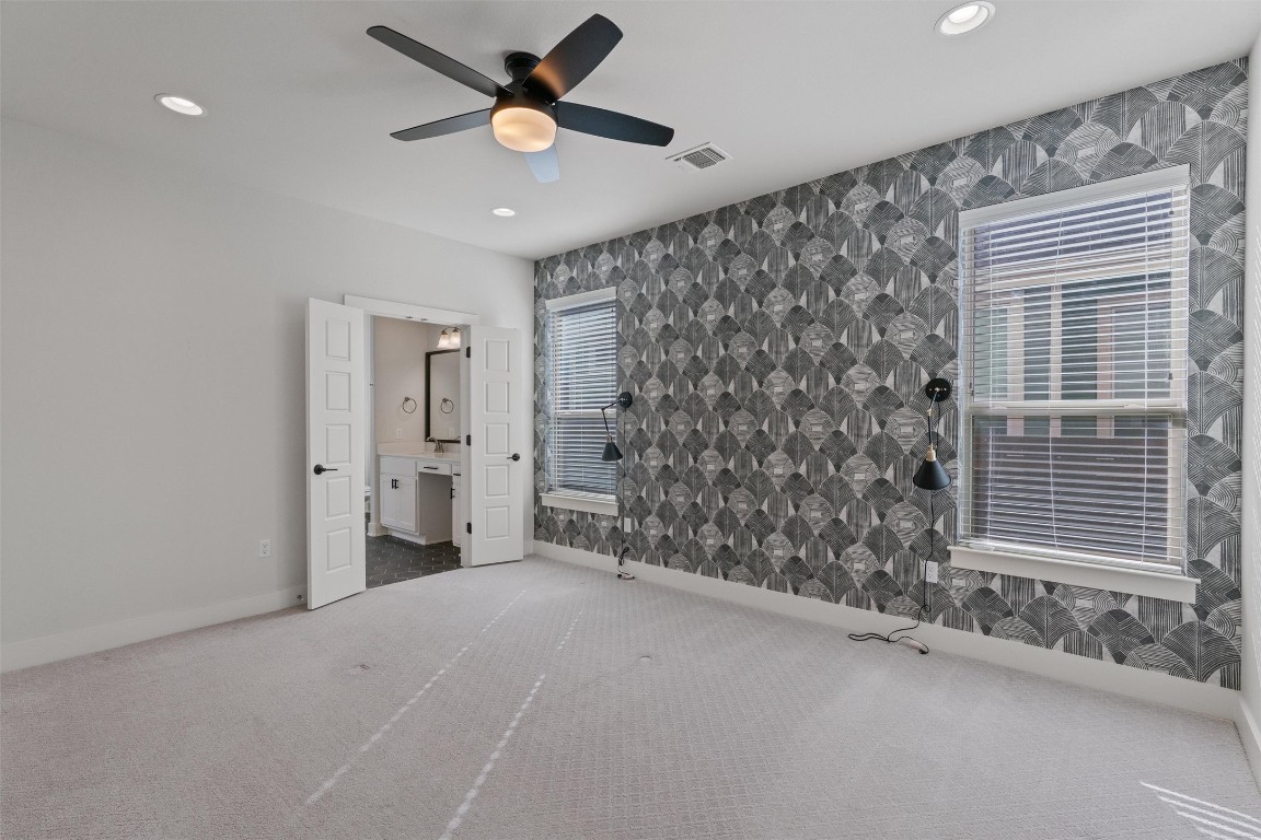 8707 Alderman Dr. Austin, TX 78747 - Photo 12 of 33 a view of a livingroom with a ceiling fan and window