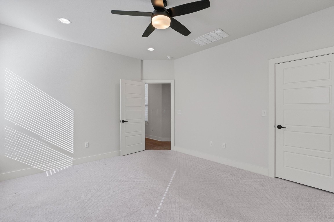 8707 Alderman Dr. Austin, TX 78747 - Photo 13 of 33 a view of an empty room and chandelier fan