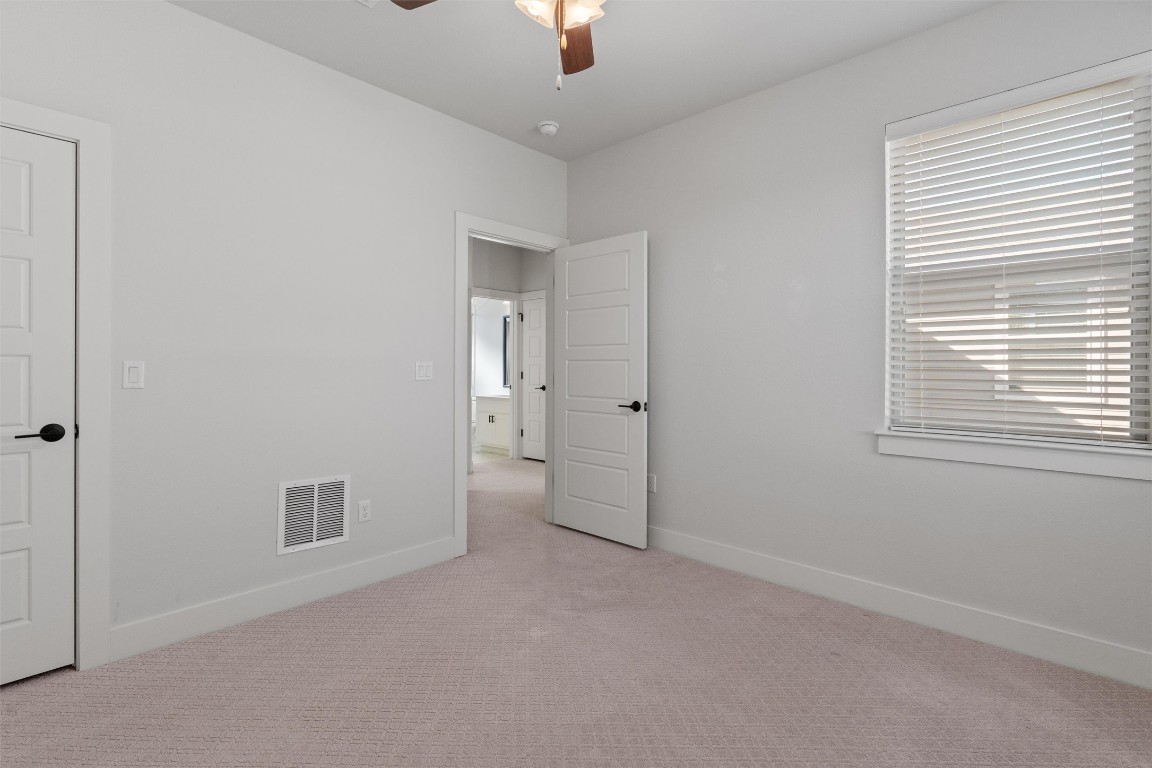 8707 Alderman Dr. Austin, TX 78747 - Photo 27 of 33 a view of empty room with window and ceiling fan