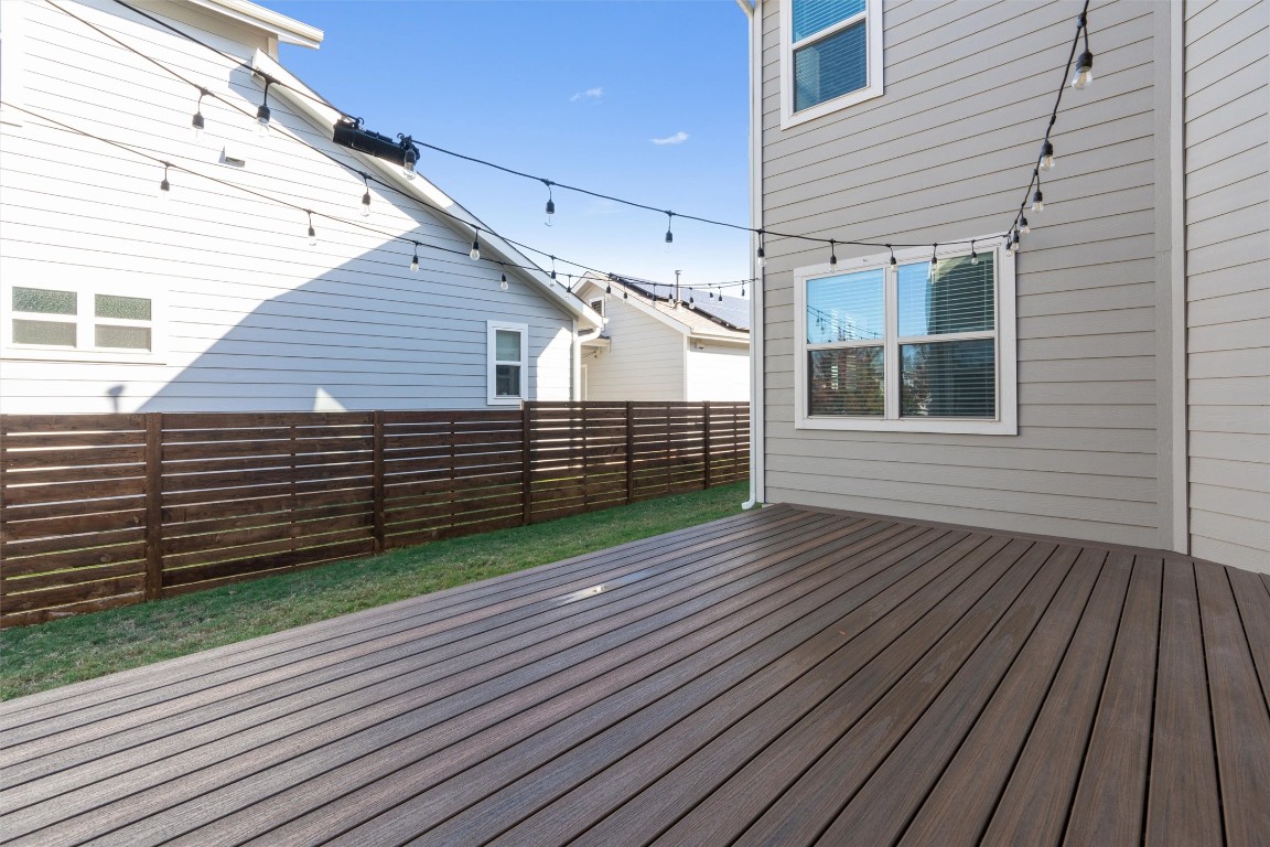 8707 Alderman Dr. Austin, TX 78747 - Photo 28 of 33 a view of a house with wooden deck