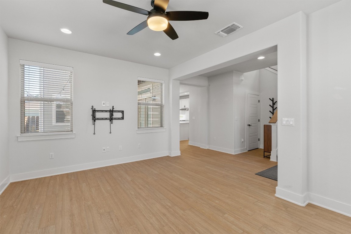8707 Alderman Dr. Austin, TX 78747 - Photo 5 of 33 wooden floor in an empty room with a window