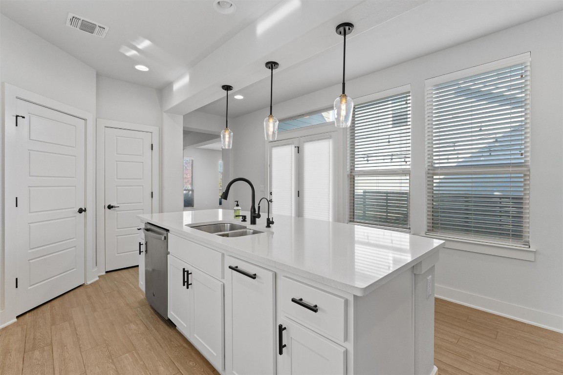 8707 Alderman Dr. Austin, TX 78747 - Photo 8 of 33 a kitchen with sink and window