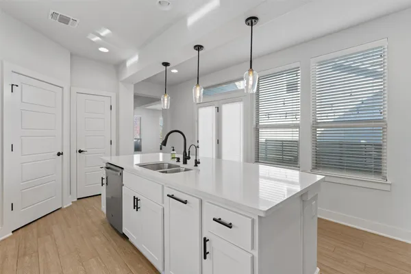 a kitchen with sink and window