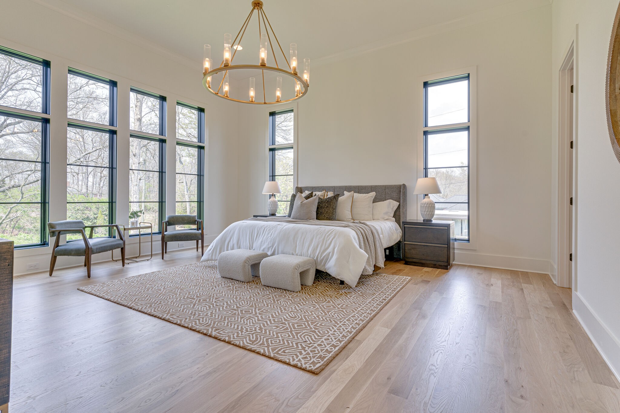 6212 Hickory Valley Road Nashville, TN 37205 - Photo 19 of 41 a spacious bedroom with a large bed and a chandelier
