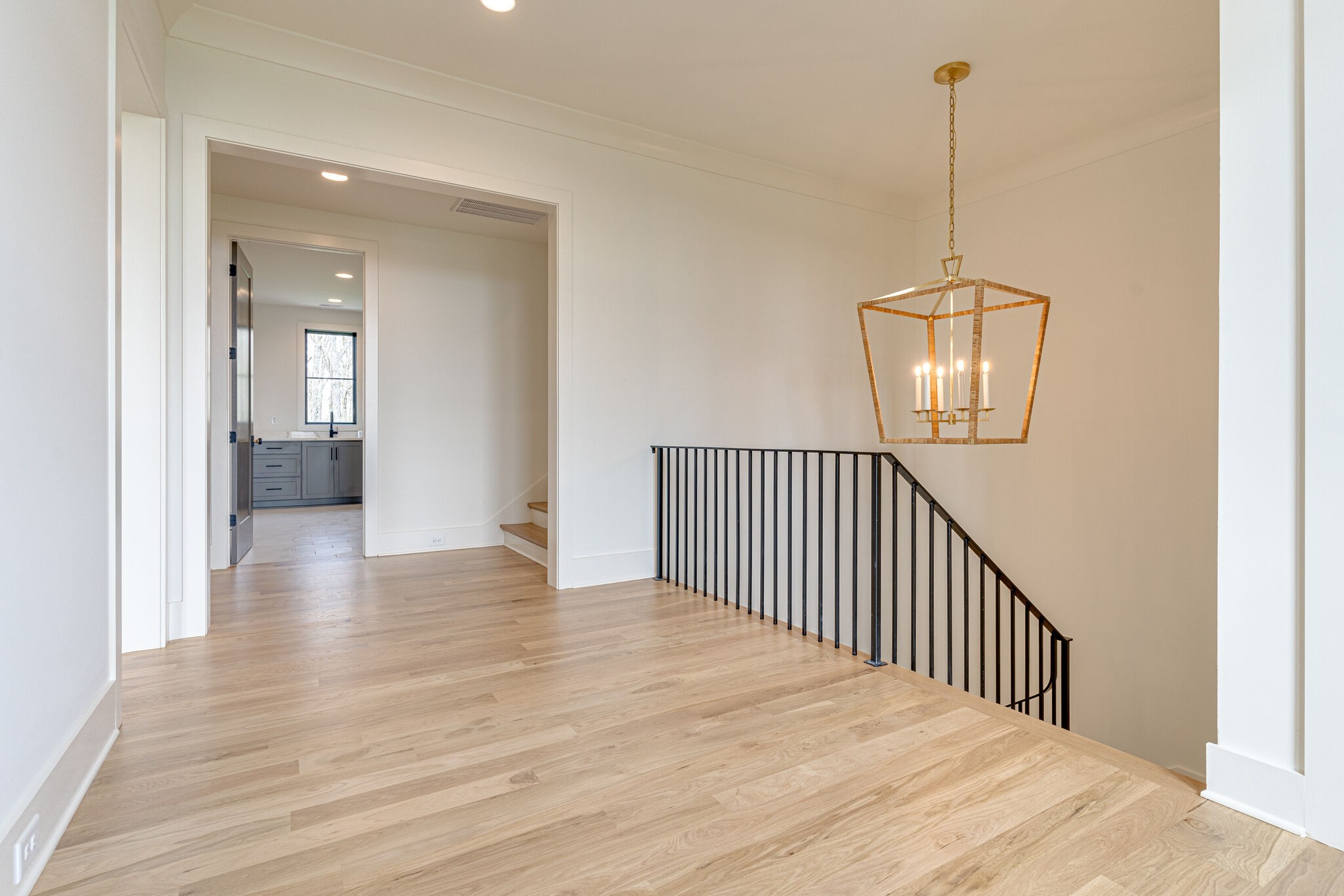 6212 Hickory Valley Road Nashville, TN 37205 - Photo 31 of 41 a view of a hallway with wooden floor and chandelier