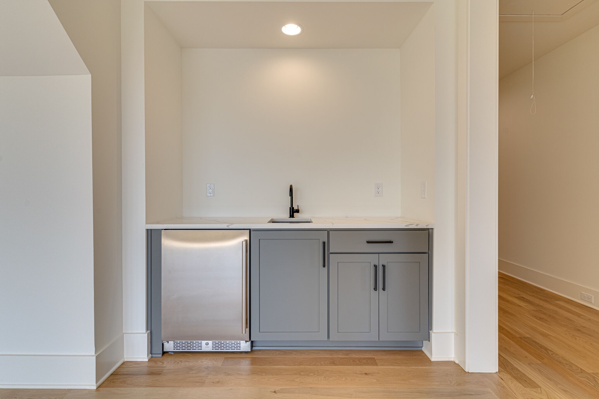 6212 Hickory Valley Road Nashville, TN 37205 - Photo 35 of 41 a view of a kitchen with a sink and wooden cabinet