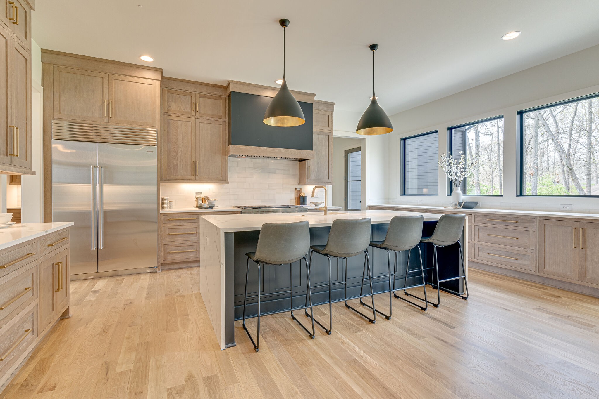 6212 Hickory Valley Road Nashville, TN 37205 - Photo 7 of 41 a dining hall with stainless steel appliances granite countertop a stove a sink a refrigerator and a dining table with chairs