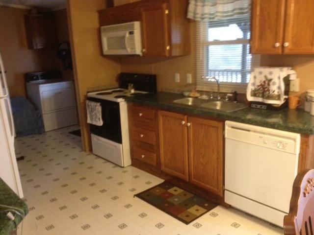 645 Cook Road Portland, TN 37148 - Photo 8 of 20 Kitchen has plenty of cabinets. Opens to the dining room and living room