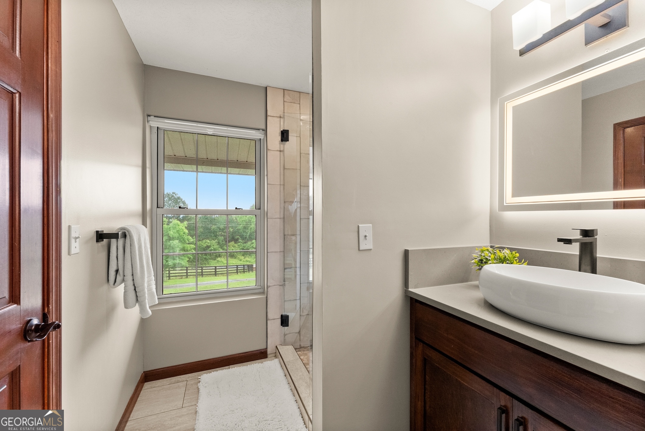 7215 Kelly Bridge Road Dawsonville, GA 30534 - Photo 37 of 81 a bathroom with a sink and a mirror