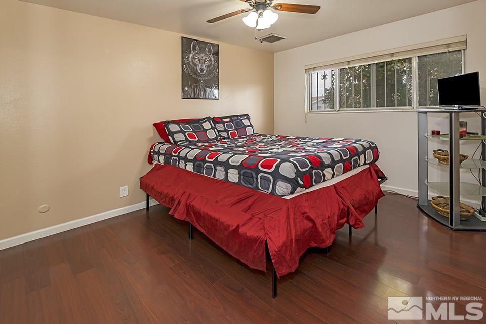 60 Smithridge Park Reno, NV 89502 - Photo 11 of 15 a bedroom with a bed and a flat screen tv