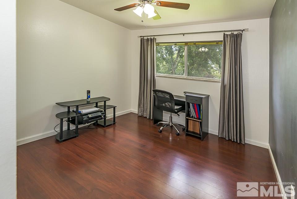 60 Smithridge Park Reno, NV 89502 - Photo 12 of 15 a living room with furniture and a wooden floor
