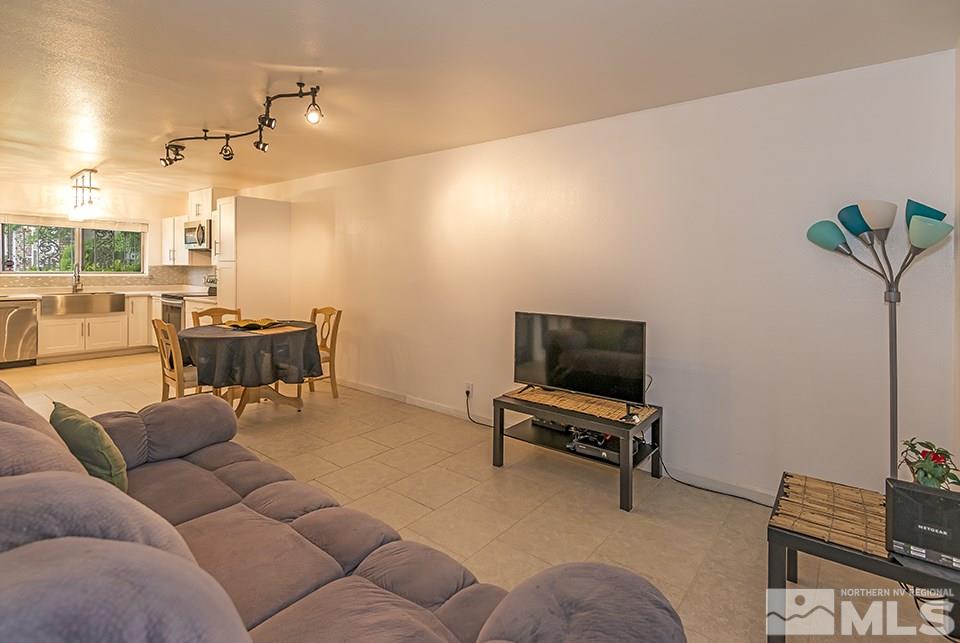 60 Smithridge Park Reno, NV 89502 - Photo 3 of 15 a living room with furniture and a flat screen tv