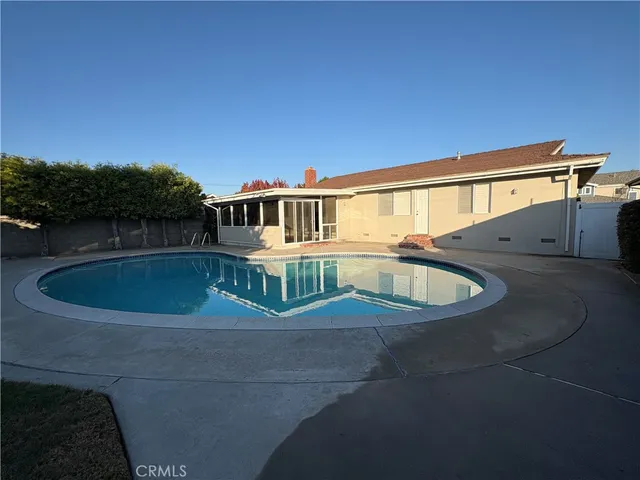 a view of a house with a swimming pool