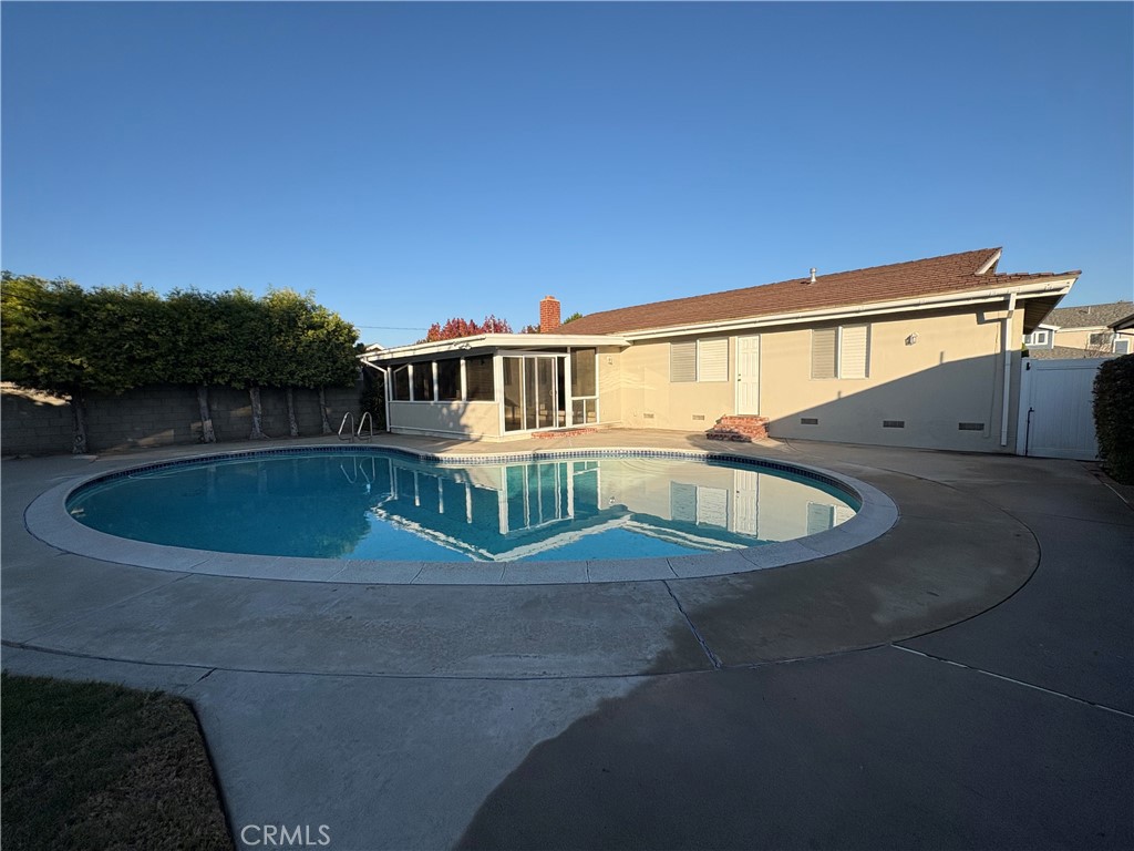 11911 East Cherry Los Alamitos, CA 90720 - Photo 12 of 12 a view of a house with a swimming pool