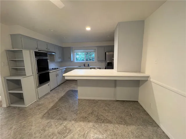 a room with a furniture and a window