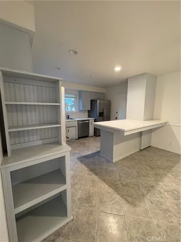 a room with a couch and cabinets