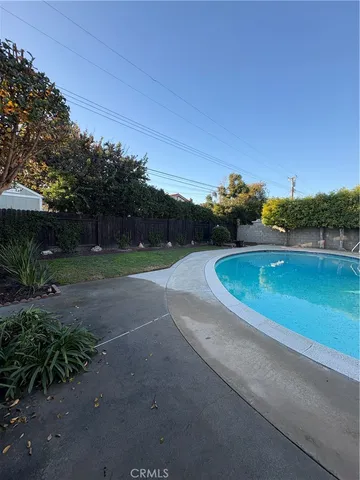a view of swimming pool with a yard