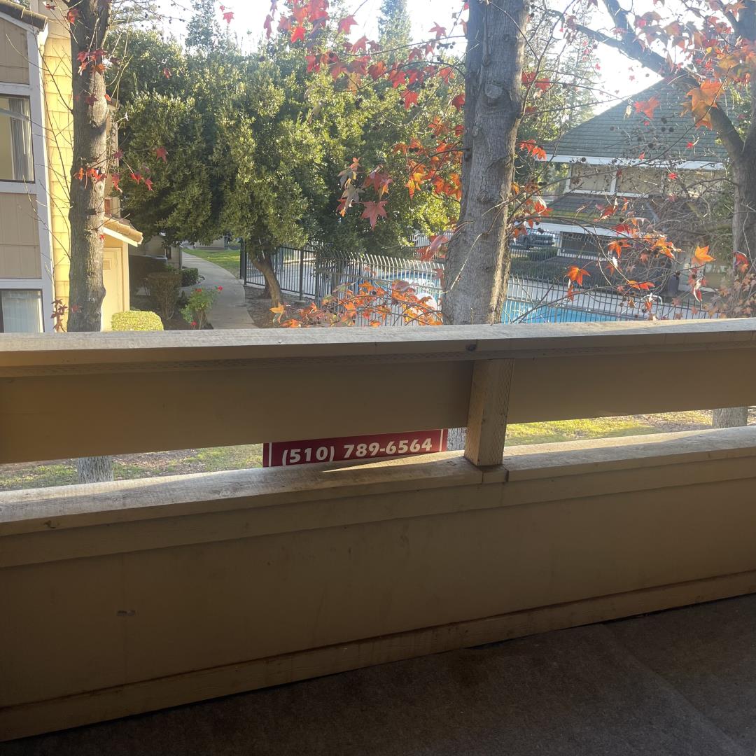 1645 Pyrenees Avenue, Unit 63 Stockton, CA 95210 - Photo 11 of 17 a view of balcony that has a tree