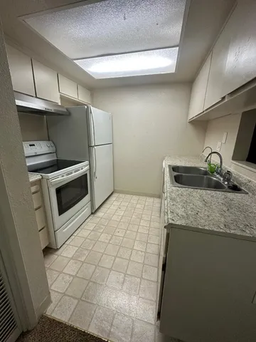 a view of house with a yard