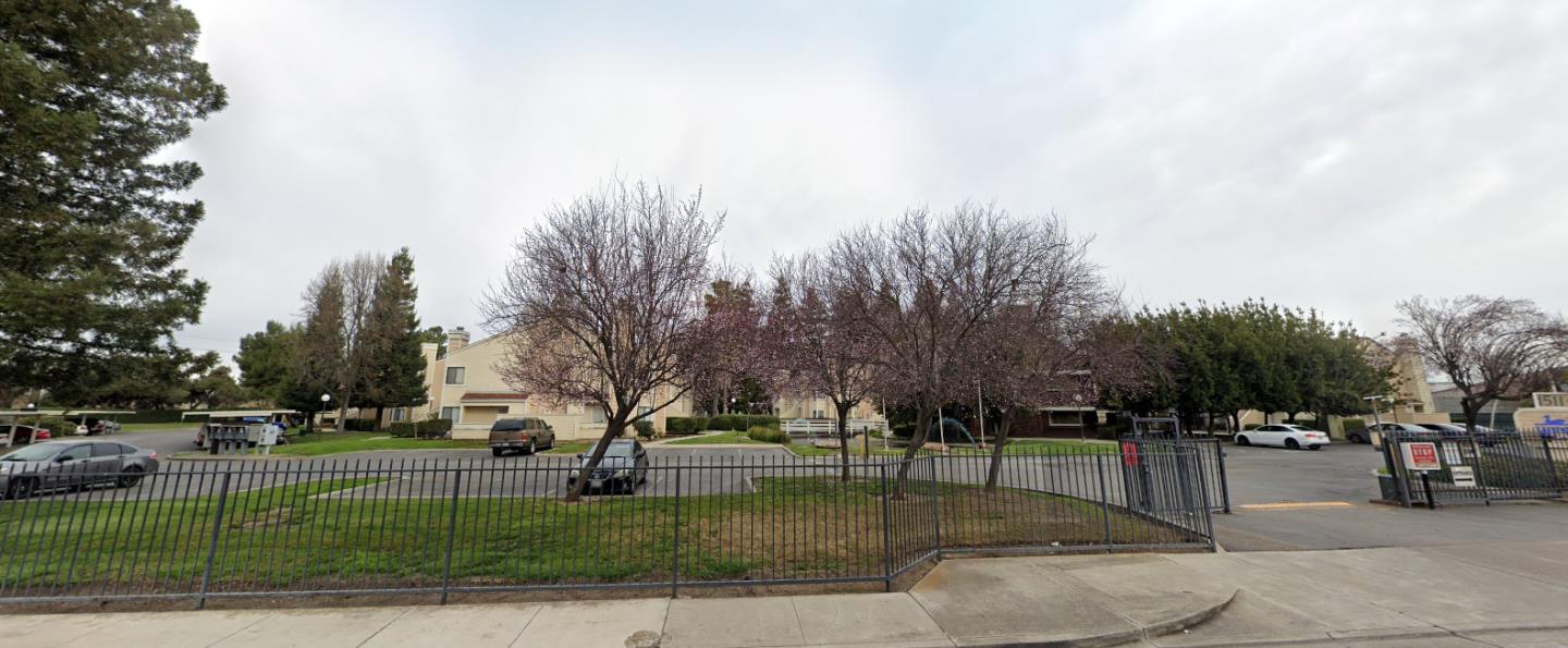 1645 Pyrenees Avenue, Unit 63 Stockton, CA 95210 - Photo 14 of 17 a view of a park with large trees