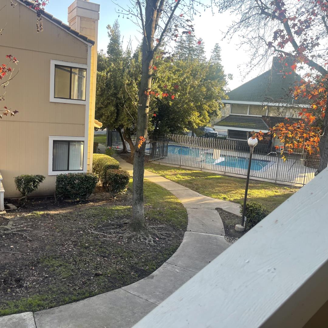 1645 Pyrenees Avenue, Unit 63 Stockton, CA 95210 - Photo 15 of 17 a view of a swimming pool with sitting area