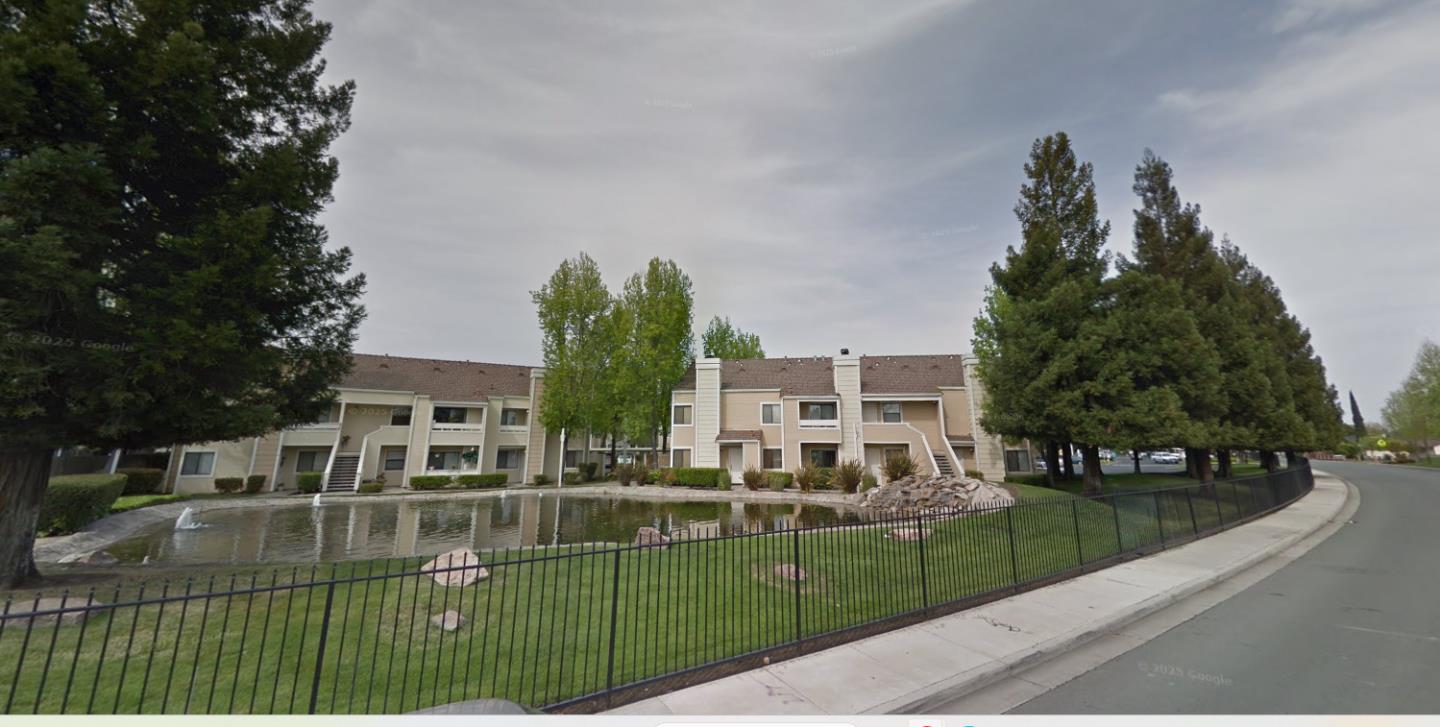 1645 Pyrenees Avenue, Unit 63 Stockton, CA 95210 - Photo 16 of 17 a view of residential houses with yard and green space