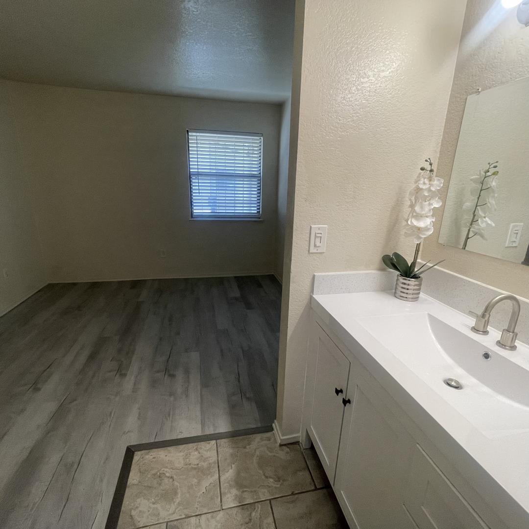 1645 Pyrenees Avenue, Unit 63 Stockton, CA 95210 - Photo 4 of 17 a bathroom with a sink and a mirror