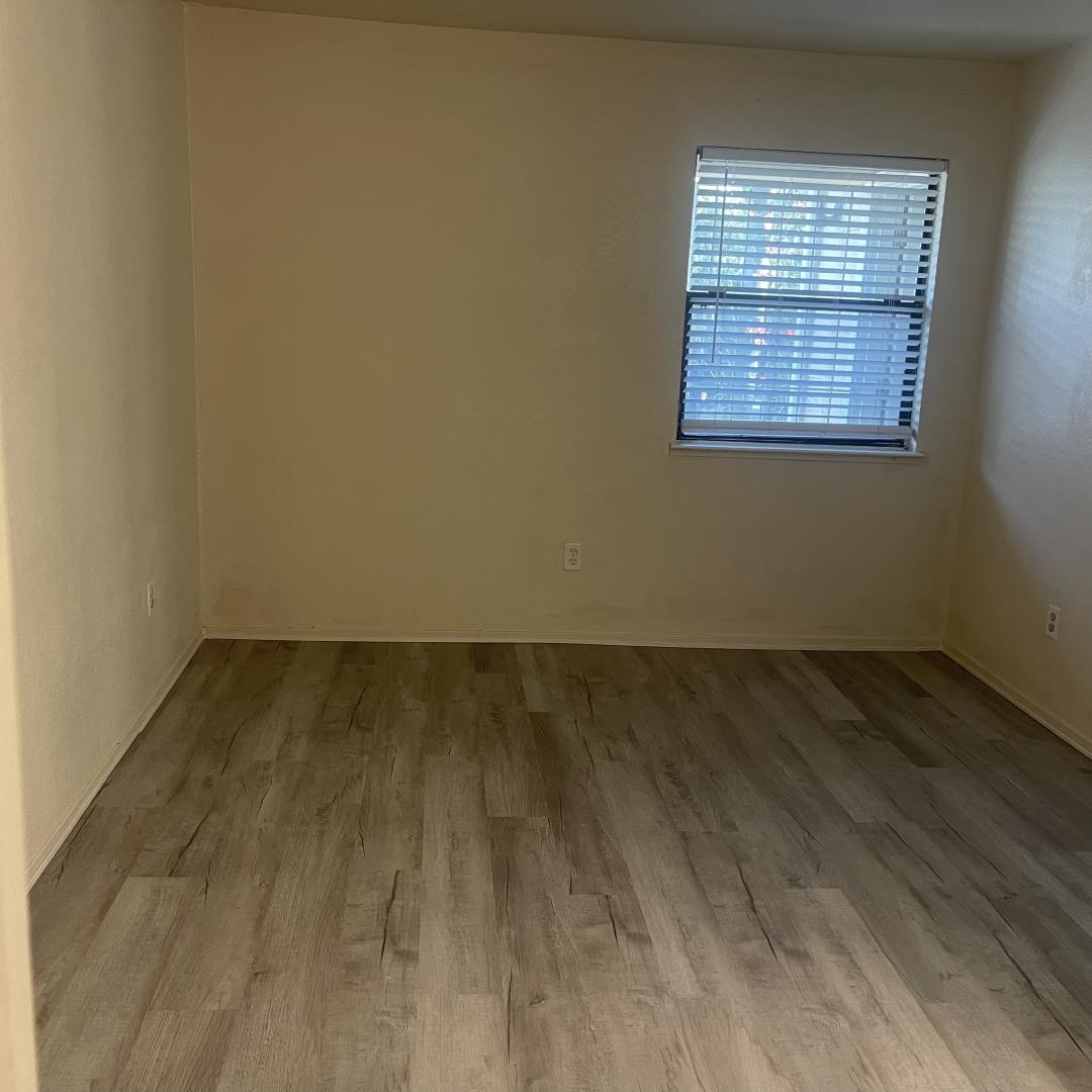1645 Pyrenees Avenue, Unit 63 Stockton, CA 95210 - Photo 7 of 17 an empty room with a window