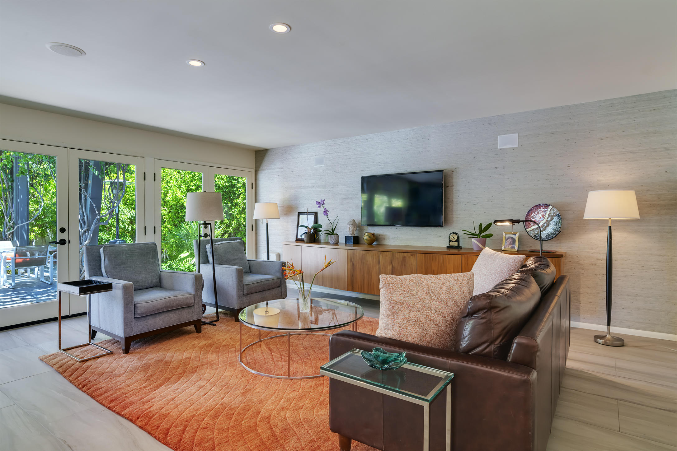70110 Chappel Road Rancho Mirage, CA 92270 - Photo 2 of 26 a living room with furniture and a flat screen tv