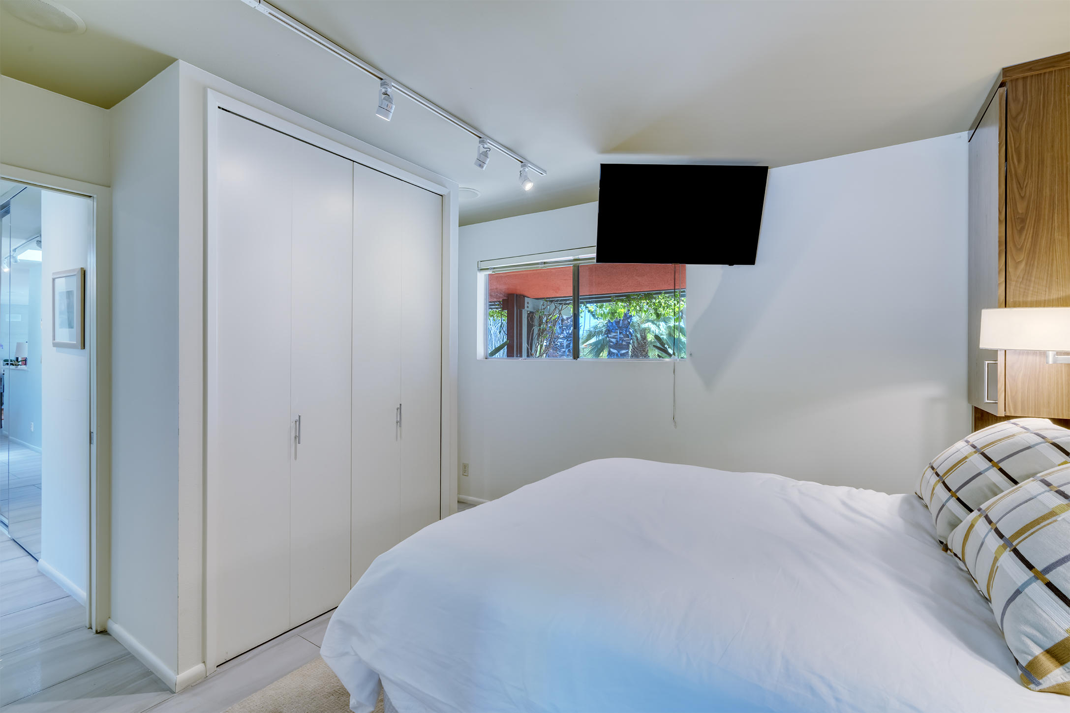 70110 Chappel Road Rancho Mirage, CA 92270 - Photo 12 of 26 a bedroom with a bed and a flat screen tv