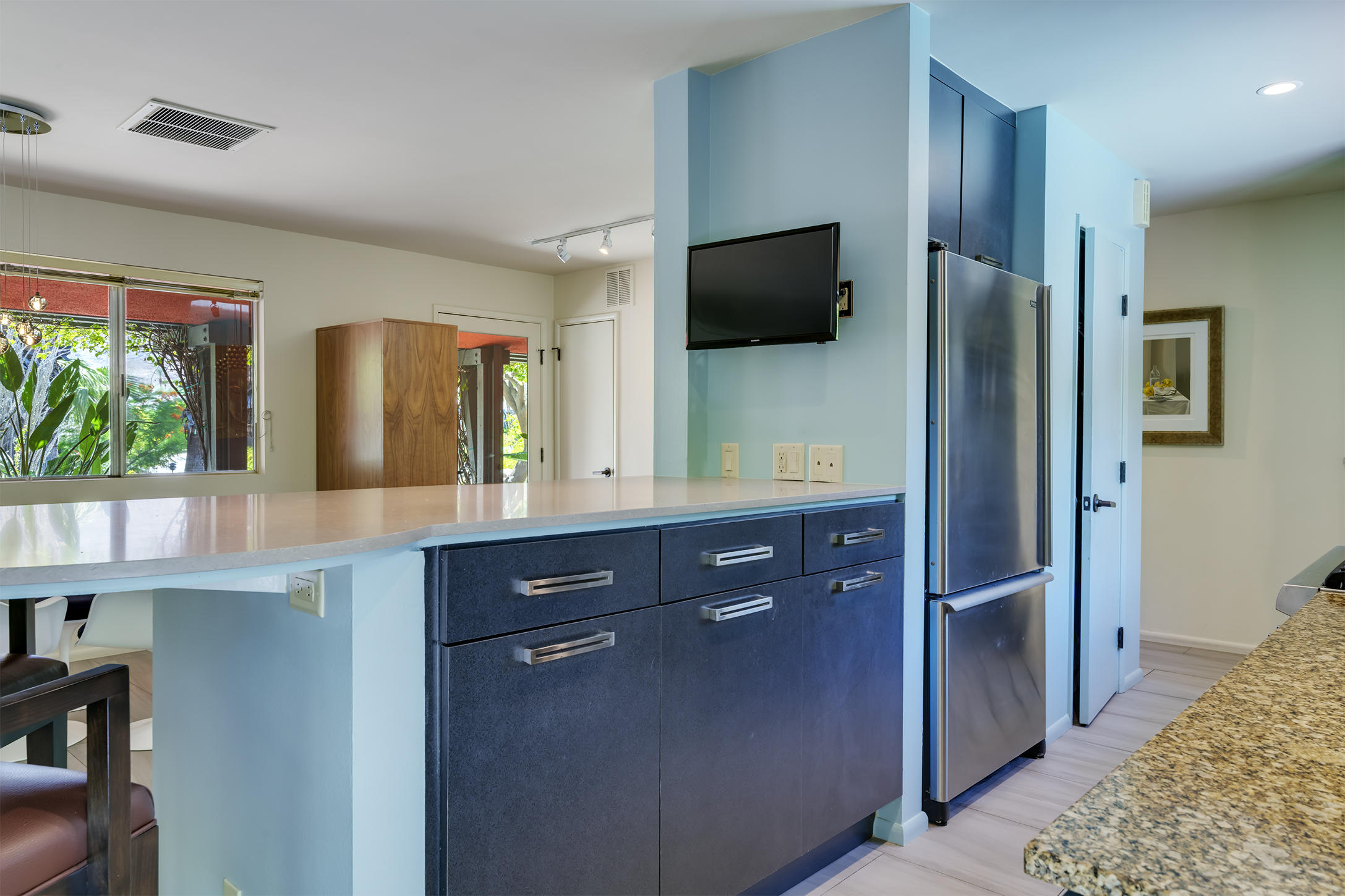 70110 Chappel Road Rancho Mirage, CA 92270 - Photo 8 of 26 a kitchen with stainless steel appliances granite countertop a refrigerator and a microwave