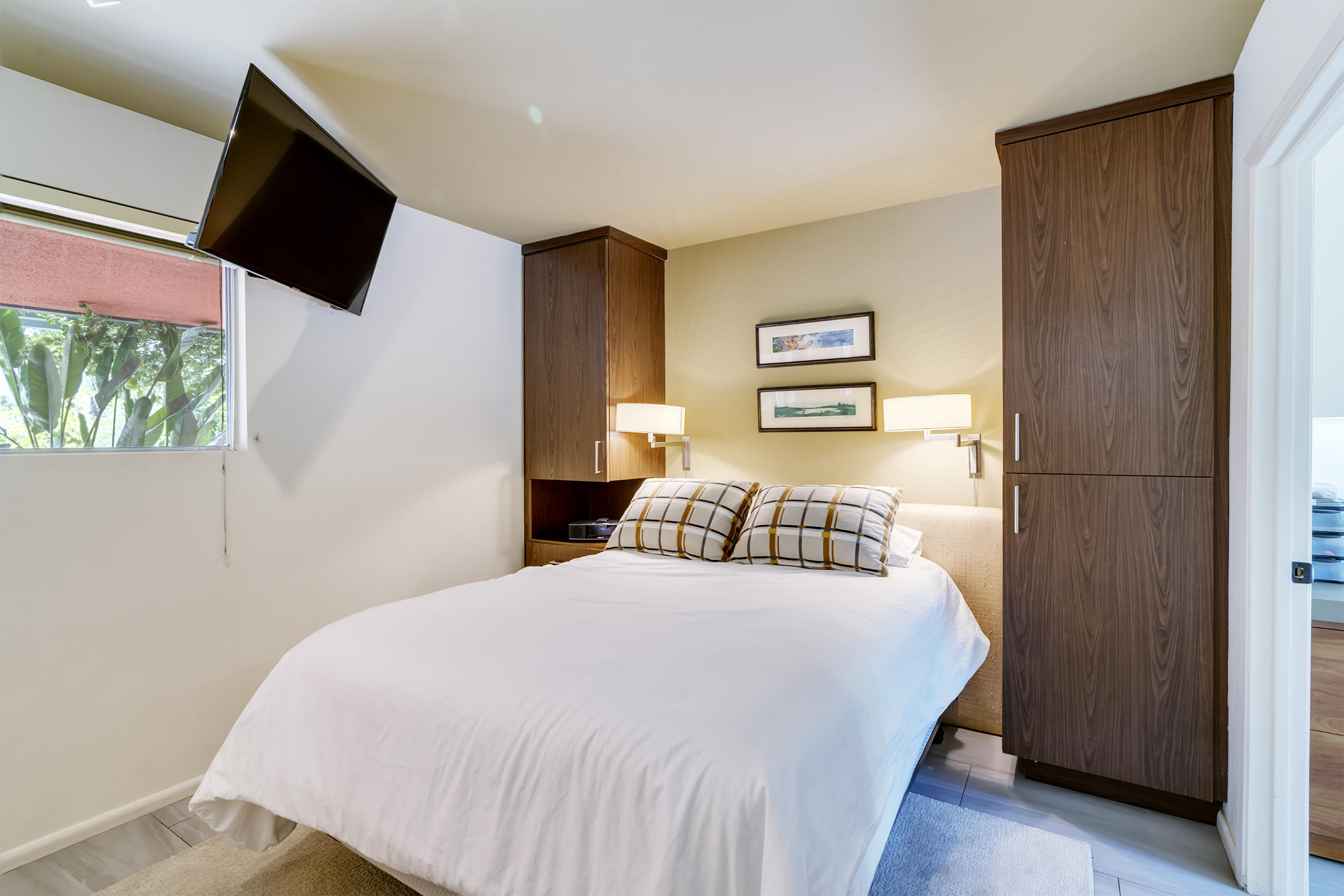 70110 Chappel Road Rancho Mirage, CA 92270 - Photo 10 of 26 a bedroom with a bed and a flat screen tv