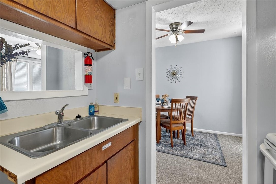 3402 Ocean Drive Corpus Christi, TX 78411 - Photo 11 of 39 a kitchen with a sink cabinets and window