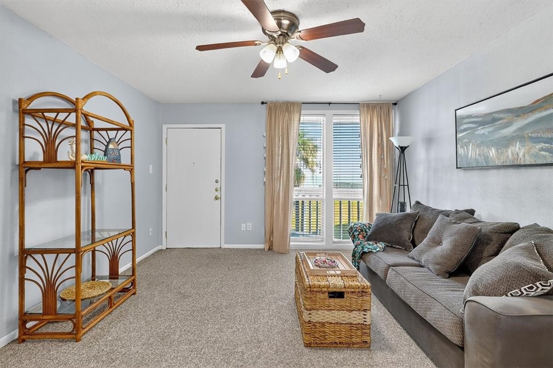3402 Ocean Drive Corpus Christi, TX 78411 - Photo 12 of 39 a living room with furniture and a window