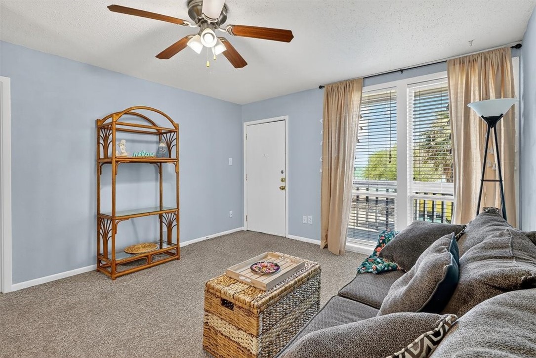 3402 Ocean Drive Corpus Christi, TX 78411 - Photo 13 of 39 a living room with furniture and a window