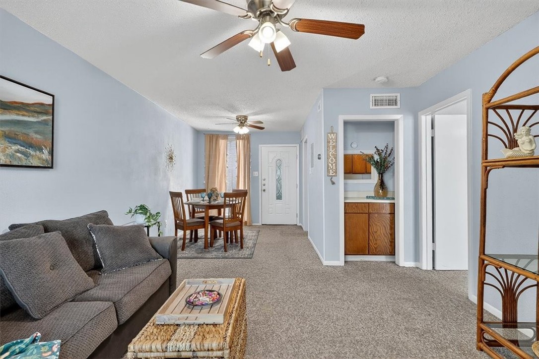 3402 Ocean Drive Corpus Christi, TX 78411 - Photo 15 of 39 a living room with furniture and a dining table