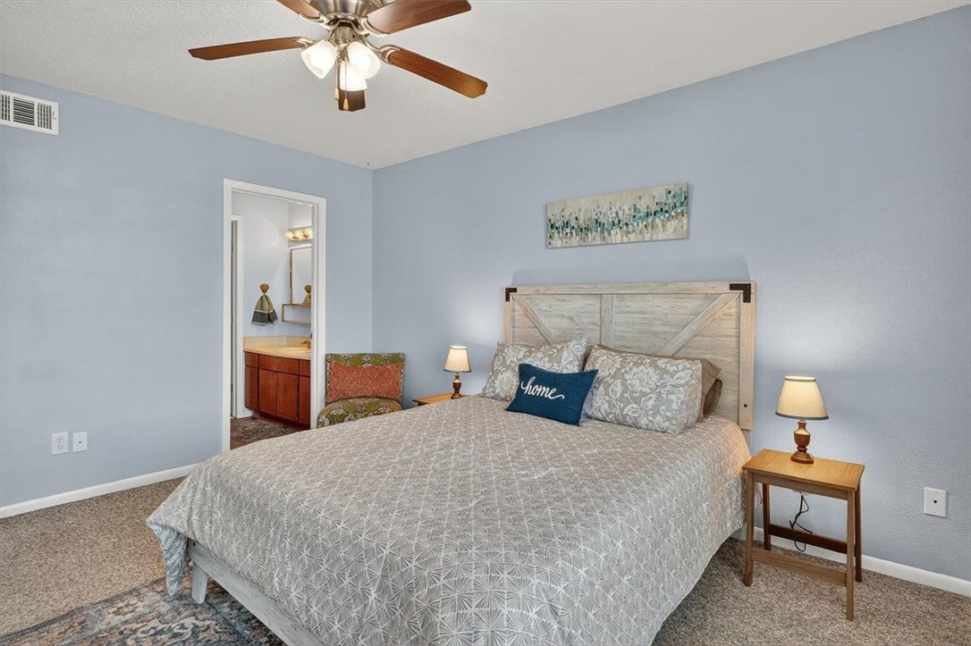 3402 Ocean Drive Corpus Christi, TX 78411 - Photo 20 of 39 a bedroom with bed and a table