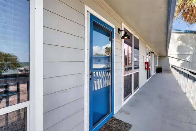a view of a hallway with seating area