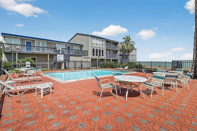 a view of a patio with swimming pool