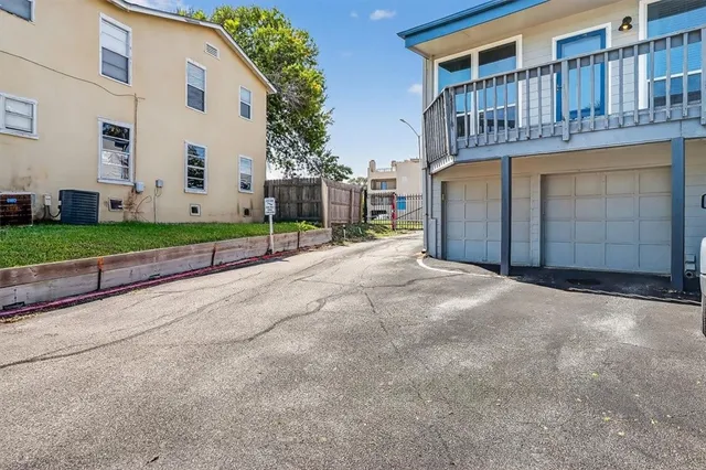 a view of a house with a yard and garage