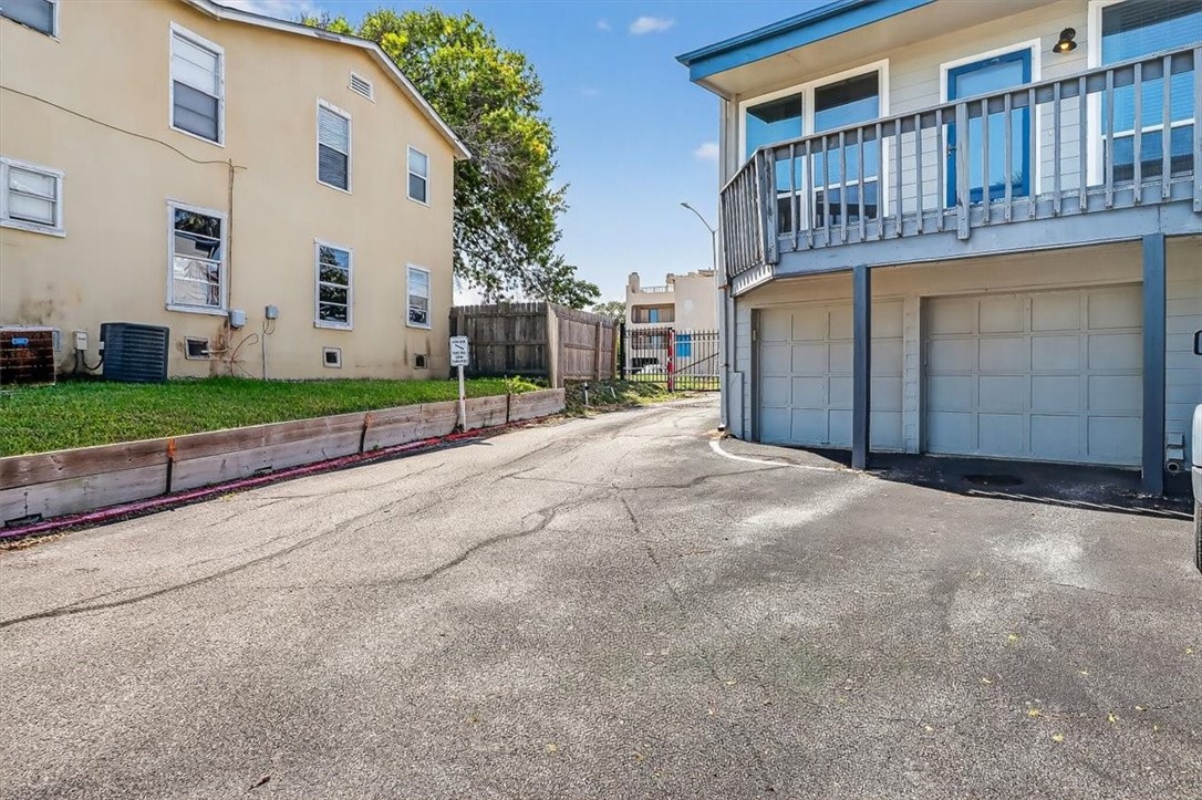 3402 Ocean Drive Corpus Christi, TX 78411 - Photo 31 of 39 a view of a house with a yard and garage