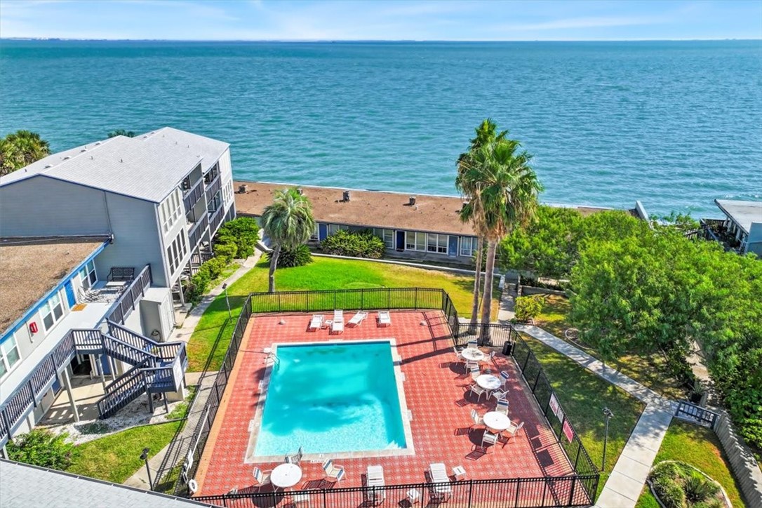 3402 Ocean Drive Corpus Christi, TX 78411 - Photo 37 of 39 a view of a tennis court with a large pool